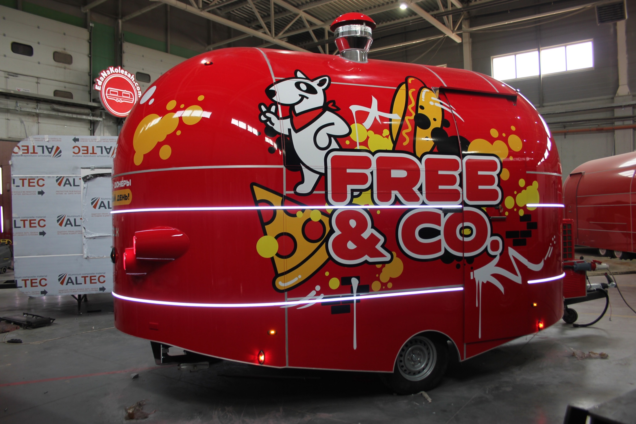 Free and Co. oversized side branding on a red commercial trailer